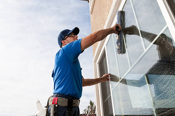 Window Cleaning Man cleaning window of a home. residential window cleaning stock pictures, royalty-free photos & images